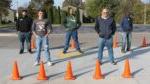 5 people lined up in parking lot