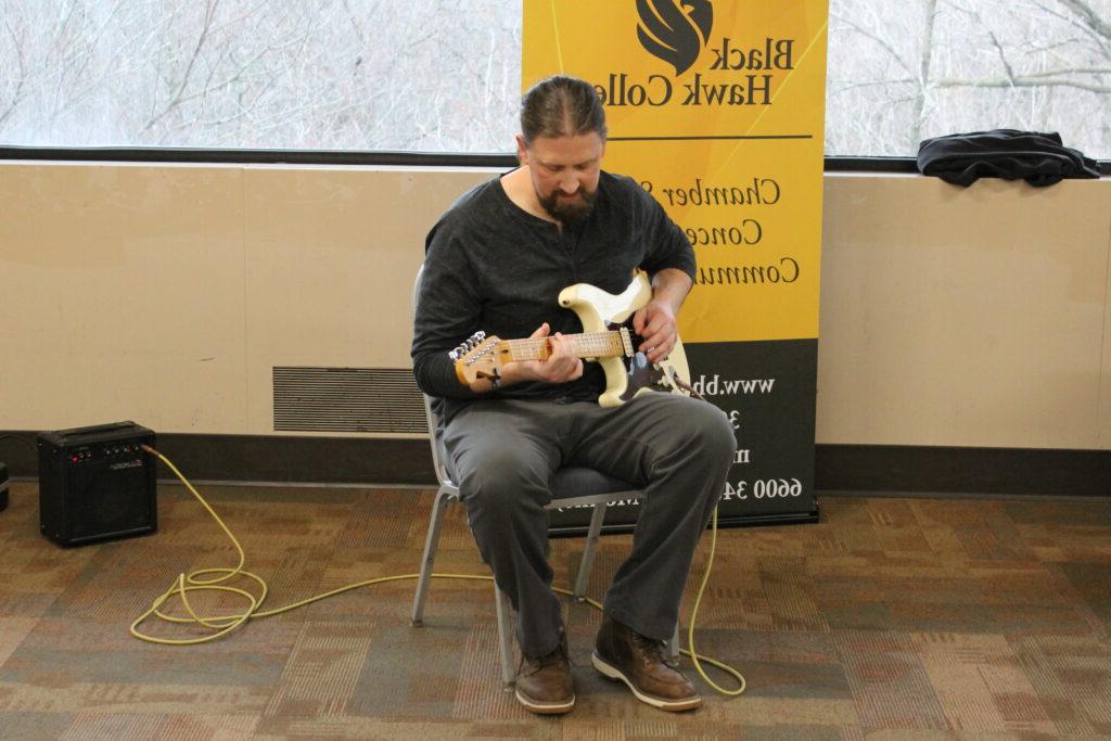 Colin Grennan playing the guitar