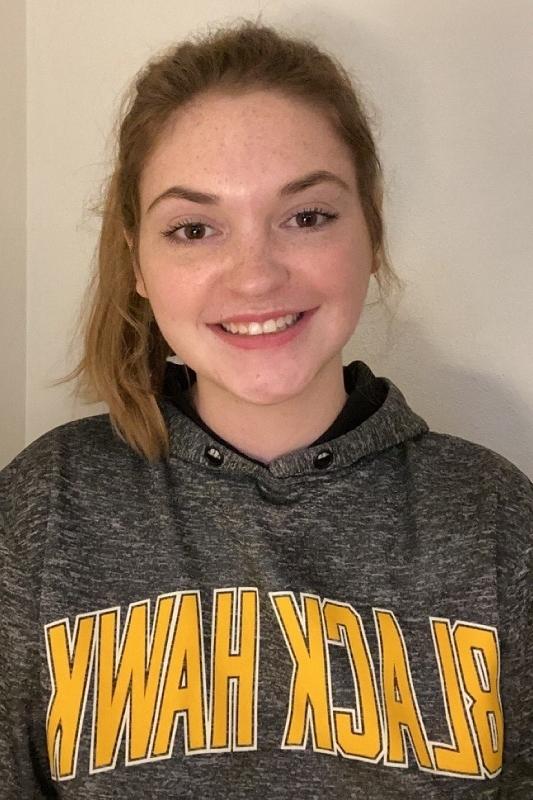 smiling female student in a Black Hawk College hoodie